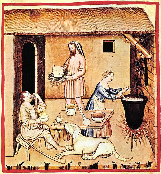 a medieval illustration of people cooking 